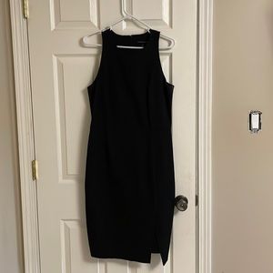 Fitted black mid length dress.